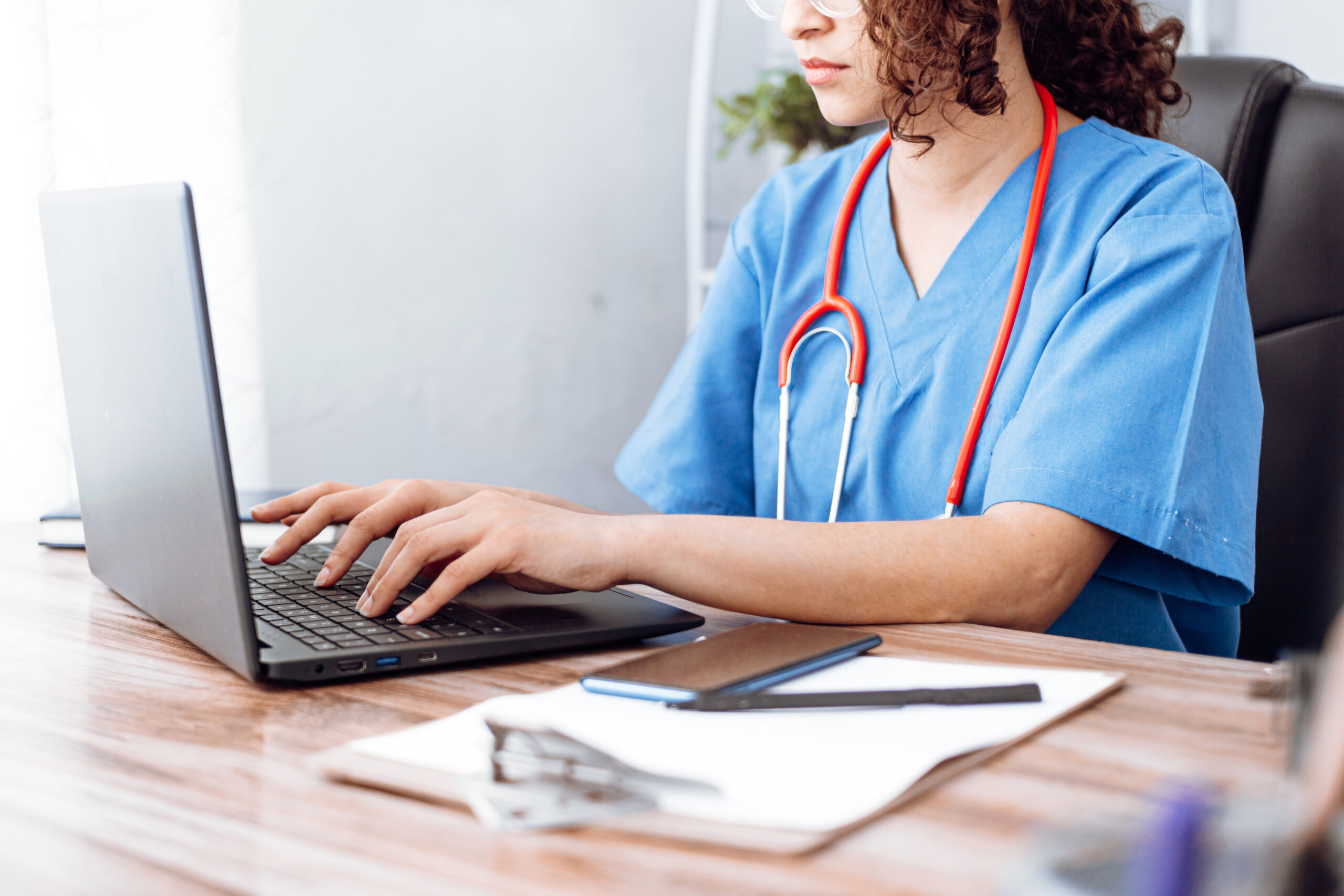 doctor using computer, nurse work on laptop.